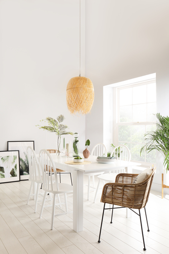 Summery dining room with rattan chairs