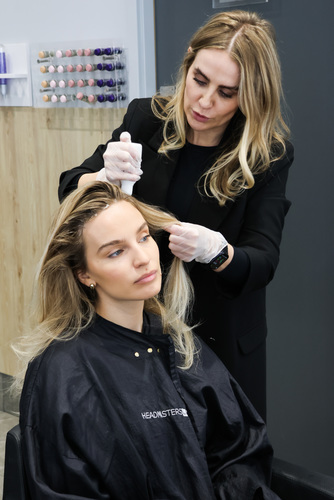 Applying Nioxin Dermabrasion Treatment