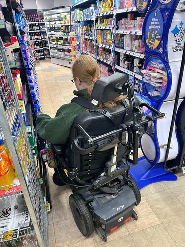 Unfair: wheelchair blocked in shop aisle