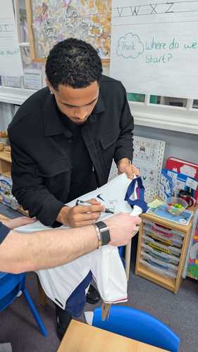 Levi Signing Shirts for Pupils