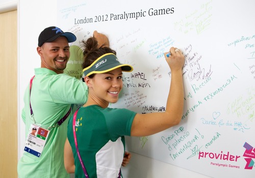 Kelly & Heinrich sign the Ottobock wall