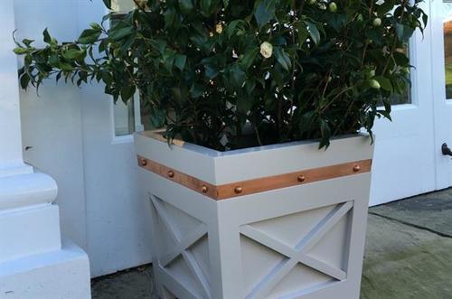Planters with a copper studded band