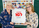 Picture of tutors with 100 anniv logo
